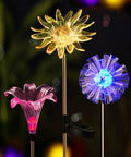 Solar Stake Lights With Color Changing LEDs And Life Size Figurines, Assorted Multicolor Outdoor Garden Decor, 3 Count For Day And Night Yard Vibe That Pops In Any Season; featuring vivid floral LED designs at night.