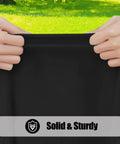 Hands stretching Six Pack Rectangle Picnic Table Cloth With Elastic Fitted Edge Waterproof Spillproof Polyester Table Cover For Indoor Outdoor Use 30x72 Inches Black Great For Camping Patio And Events