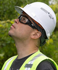 Worker wearing All Day Safety Glasses With Full Frame Design, Anti Fog And Scratch Resistant Lenses For Indoor Outdoor Work.