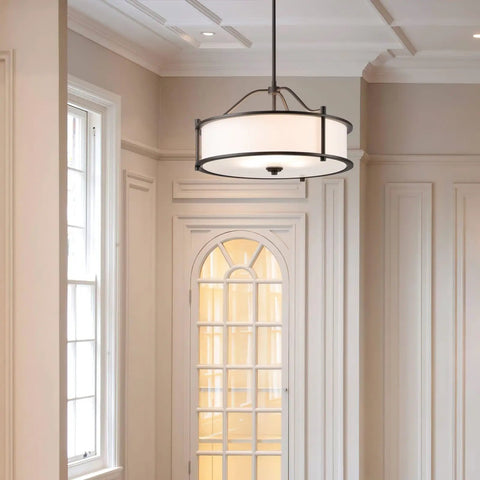 Dark Bronze 18 Inch 3 Light Drum Pendant with Fabric Shade and Glass Diffuser in elegant living room setting
