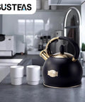 Stove Top Whistling Tea Kettle 2.64 Quart With Food Grade Stainless Steel Teakettle And No Sweat Cool Touch Ergonomic Handle, Push Button Pouring, Includes Silicone Mitt, Black Finish.