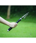 Person holding Telescopic Fishing Rod And Reel Combo 6.9 Foot 2 Piece Set With Carrier Bag Carbon Fiber Spinning Rod for Freshwater Angling