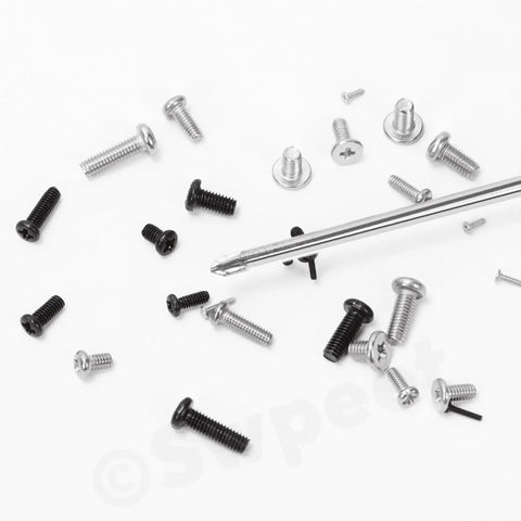Assorted sizes of 1200 Piece Phillips Flat Head Machine Screw Set For DIYers And Furniture Projects, scattered with a screwdriver.