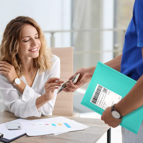 Person handing over a Teal Bubble Mailers 10.5x16 Inch 25 Pack Poly Padded Envelopes Self Seal Waterproof Opaque Packaging For Clothes Large #5