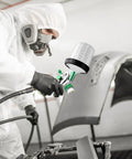 Painter using Paint Sprayer Kit With Quick Mixing Cup, HVLP Spray Gun, 1.4, 1.7, and 2.0mm Nozzles on car panel