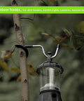 Sturdy Stainless Steel Outdoor Lighting Hooks For Camping Tents And Garden Lights Anti Slip Rubber Grip on branch with lantern.