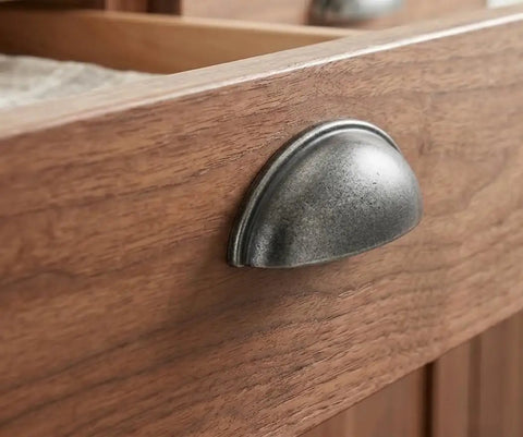Close-up of Top Tier Weathered Nickel Cabinet Handles 25 Pack 3 Inch Hole Spacing, zinc pull on wooden drawer.