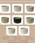 Various colors of shallow drum hardback lamp shades including options in white, beige, and black; front view display