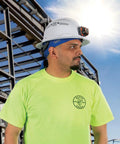 Worker wearing Cooling Bandana Sweat Wicking Skull Cap For Under Helmet Adjustable 2-Pack With Elastic Band outdoors