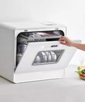 Portable Countertop Dishwasher Fully Automatic Compact Kitchen Essential With Intelligent Air Dry and Spacious Rollout Basket for Tiny Homes open with dishes inside.