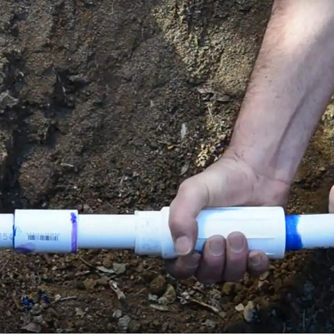 Pro Span PVC Expansion Repair Coupling For Cracked Or Broken In Ground Pipes 1 Inch IPS being installed in soil