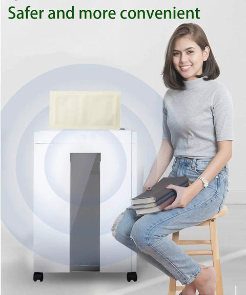Woman sitting next to shredder with Shredder Lubricant Sheets 20 Pack on top, enhancing clean lubricate and sharpen blades function.