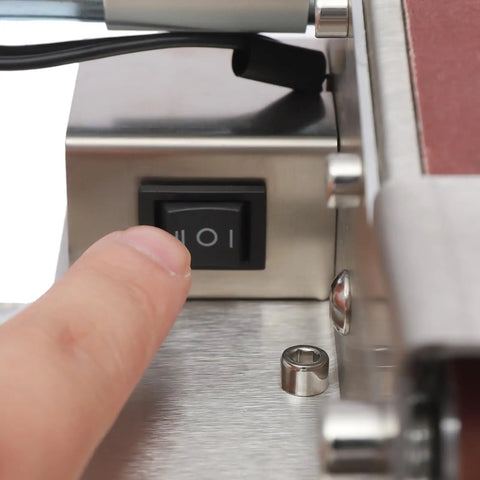 Close-up of the power switch on the No Hassle Workhorse Mini Belt Sander And Knife Sharpener.