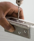 Person installing hinge on door, not relevant to Stainless Steel 90 Degree L Shaped Corner Braces 8 Pack Heavy Duty Angle Brackets