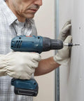 Person using drill to install Six By One Inch Bugle Head Drywall Screw With Coarse Thread And Sharp Point in home renovation project.