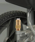 Brass release valve for pressure washer pump, 1/4 in NPT, installed on pump (close-up view)