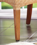 Wooden chair leg with 40 Piece Brown Round No Slip Floor Protectors For Chair And Table Legs Noise Proof Glides visible on tile floor.