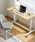 Electric Sit Stand Desk Offering Smooth Height Adjustment, Mobile Rolling Computer Workstation For Home Office, Ergonomic Lift Table with grey chair.