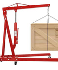 Heavy Duty Garage Workhorse: 2 Ton Hydraulic Engine Hoist With Adjustable 0.5 To 2T Range lifting a wooden crate.