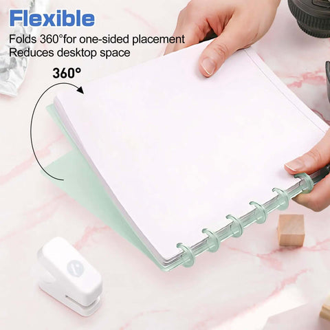 Mini Mushroom Hole Punch 1 Hole Puncher Handheld Paper Punch for Booklets and Crafts shown on pink marble desk with ringed paper