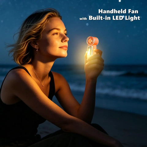 Woman holding Beast Portable Handheld Fan On The Go With USB-C Rechargeable Battery, digital display lit at night