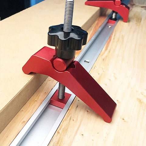 Aluminum T Track Hold Down Clamp For Woodworking securely positioned on a wooden board, showcasing ergonomic grip and strong clamping force.