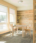 Bright room with wooden walls, table, and chairs near windows, not showing Flex Gray Vinyl Wall Base 4 Inch By 20 Foot With Peel And Stick Adhesive.