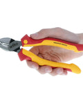 Hand holding insulated industrial pliers and cutters set, 3 piece, 8 inch each, pro grade electrician tools kit with cushioned grip