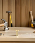 Adjustable Aluminum Alloy Furniture Legs Round Golden Cabinet Feet With Rubber Base Set Of Four on wooden workbench.