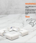 Slimfit Corner Edge Protector For Baby Proofing pieces on marble surface with warning text and product dimensions diagram