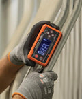 Digital Level And Angle Gauge Kit With Plumbers Straps Magnetic Base And Alarm For Pros in use on metal pipe