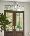 5-Light French Country Chandelier With Adjustable Height in smoked cedar and rustic metal finish hanging in an entryway.