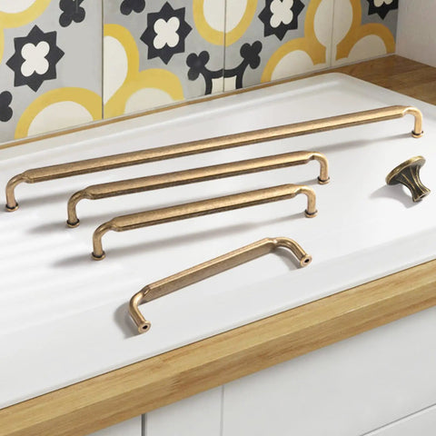 Six Pack Antique Brass Cabinet Knobs Zinc Alloy For Kitchen Drawers 2202 GT DAN on table with screws