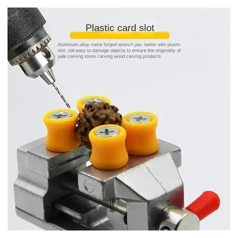 Super Durable Cast Iron Small Bench Vise With Suction Cup Flat Jaws And Precision Clamping Power For Hardwood Carving DIY Projects At Home Workshop Or Garage Table Use in action with plastic card slot.