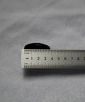 Fuchi Kashira Iron Alloy Set For Samurai Tsuka Handle Ferrule Caps 01 To 07 with ruler for size reference on a gray background