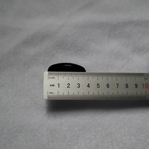 Fuchi Kashira Iron Alloy Set For Samurai Tsuka Handle Ferrule Caps 01 To 07 with ruler for size reference on a gray background