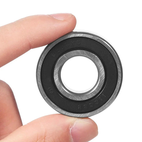 Hand holding Sealed Deep Groove Miniature Ball Bearings Kit For Electric Vehicle Hubs High Speed Rear Axle Bearings Wear Resistant Replacement For EV Drives And Hub Upgrades