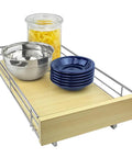 Smooth Operator Slide Out Cabinet Organizer Pull Out Drawer With Polished Chrome Finish And Laminated Wood holding bowls and jar.