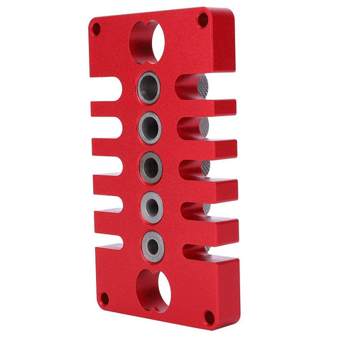 Red Punch Positioner Dowel Jig 3-In-1 Drill Guide Block for woodworking, shown from the side, with aluminum build and precise holes.