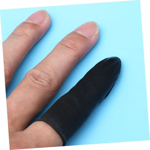 1000 Piece Black Latex Finger Sleeves Block Sneaky Sweat Smudges And Greasy Fingerprints From Messing With Pristine Hardware For Tough Shop Floor Crews And Weekend Gearheads Fixing Tight Builds on a finger against a blue background.