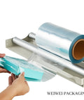 Heavy Duty Odorless PVC Heat Shrink Wrap Film Roll, 10 Inch By 500 Feet, 75 Gauge Centerfold being used for packaging a box.