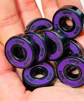 Hand holding Skateboard Bearings 8mm 8 Pack Pro Grade ABEC 608 Set For Longboards Cruisers Surfskates Quad Roller Skates