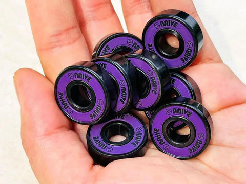 Hand holding Skateboard Bearings 8mm 8 Pack Pro Grade ABEC 608 Set For Longboards Cruisers Surfskates Quad Roller Skates