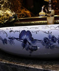 Heavy Duty Morning Glory Oval Bathroom Sink Crafted From Glossy Ceramic Featuring No Splash Countertop Mount And Sloped Drainage For Easy Cleanup and Total Powder Room Vibes with floral design.