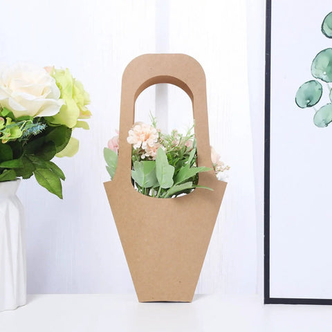 30 Pack Kraft Paper Flower Gift Bags With Handles For Bouquets And Gifts No Fuss Easy Carry Party Favor Bags For Thanksgiving Birthday Wedding And Other Celebrations, showing a kraft paper bag holding flowers