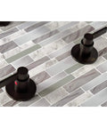 NuvoFusion Double-Handle Tub And Shower Faucet in polished brass with durable brass construction on tiled surface.