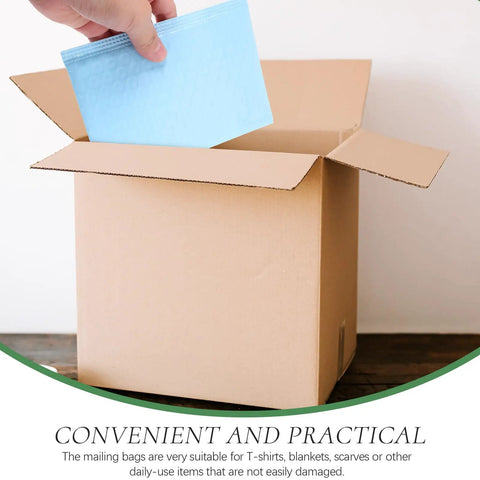 Person placing Milk Blue Bubble Mailer Bags 100 Pack Self Sealing Thickened 11x15 Plus 4 Inch Envelopes into a cardboard box