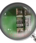 R12 12 Amp 600V Fast Acting Fuse for Industrial Circuits and Electrical Panels under magnifying glass