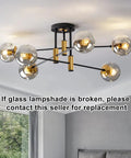 Six Light Sputnik Glass Globe Chandelier in Black and Gold Modern Mid Century Pendant Light in living room setting