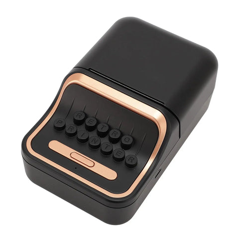 Cool Retro Label Printer With Bluetooth 5.0 Connectivity And Compact Design Perfect For Home Office Organization Tasks Features Inkless Thermal Printing Technology Compatible With A Range Of Paper Widths From Thirty Two Millimeters To Fifty Two top view of compact black label printer with rose gold accents and buttons.